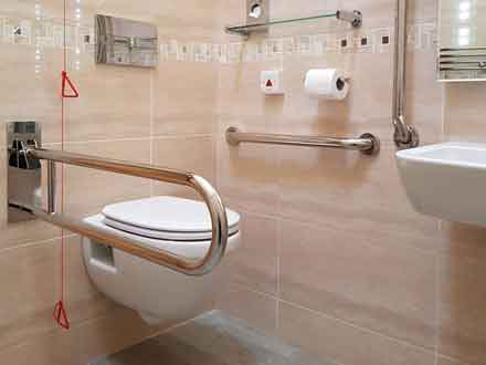 Wheelchair accessible wet room with grab rails